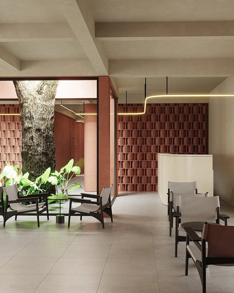 Lounge seating around a courtyard tree inside ASAI Village