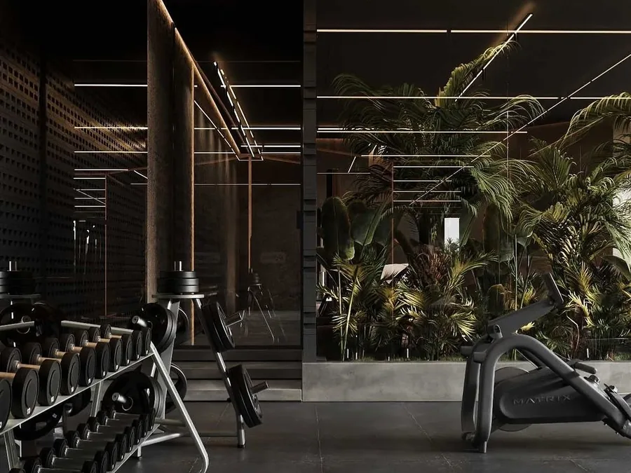 Open functional training area with warm linear lighting