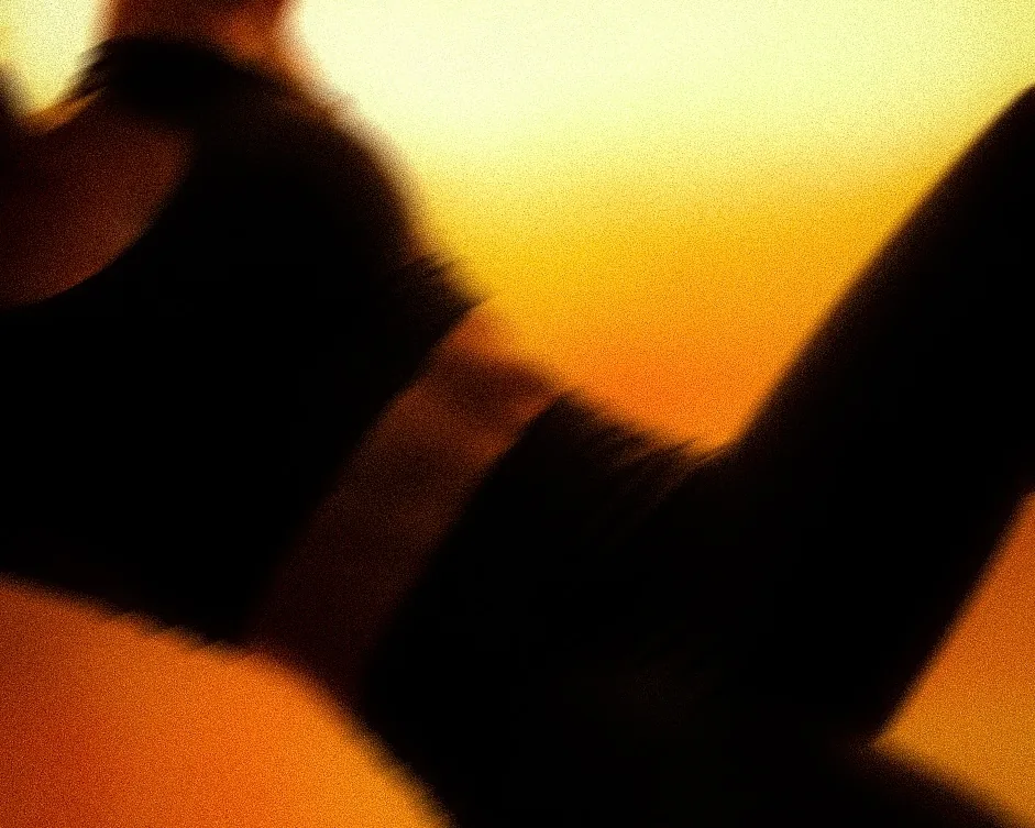 A member in silhouette against the golden evening light of ASAI GYM