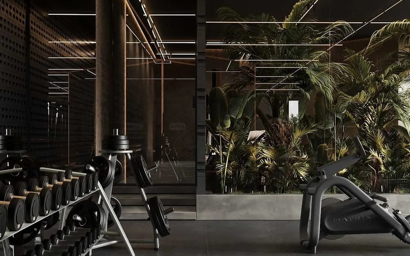 Strength floor with dark stone, warm light and tropical planting