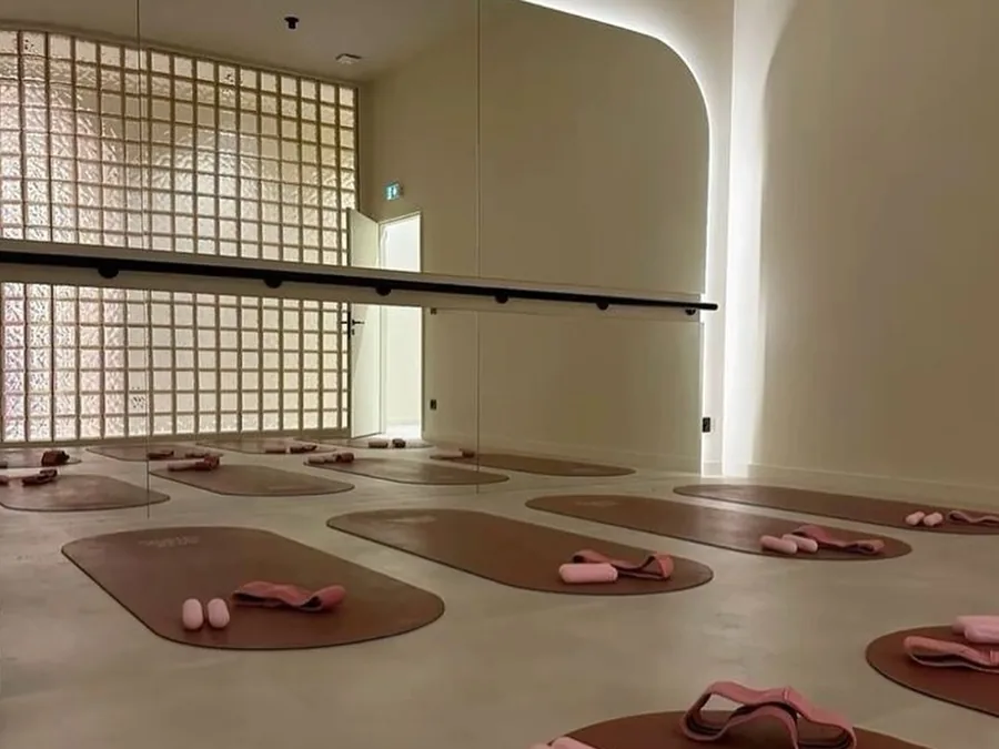 Studio floor laid out with terracotta mats and props