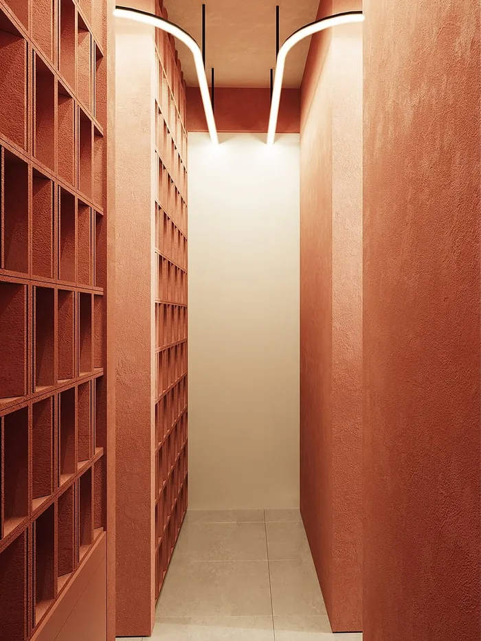Terracotta corridor with sculpted lighting