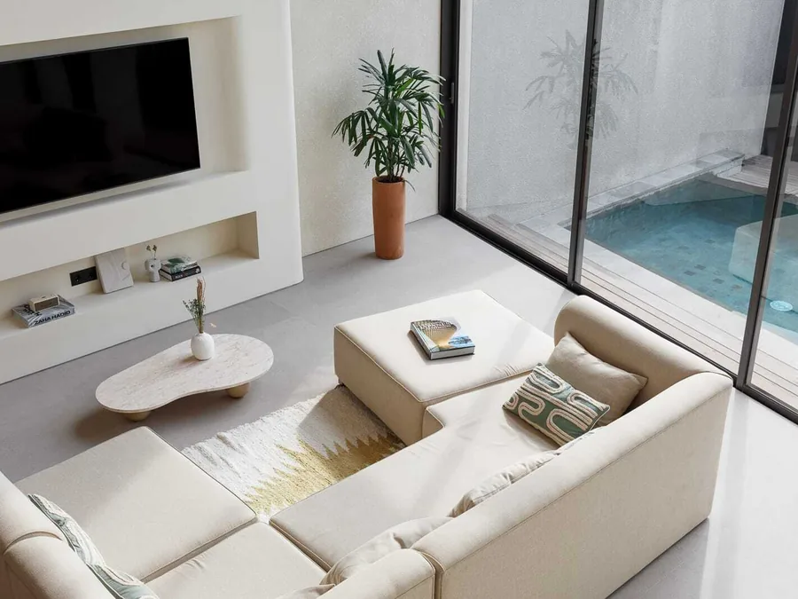 A villa living room opening onto the pool at ASAI Village