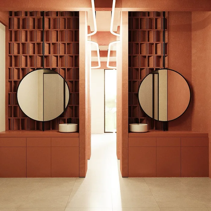 Round mirrors above stone basins